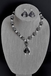 Show details for Black and White Stripe Acoustic Guitar Pick Necklace Picture of Black and White Stripe Acoustic Guitar Pick Necklace